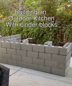 an outdoor kitchen made out of cinder blocks with the words building an outdoor kitchen with cinder blocks