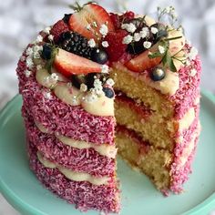 a cake that has been cut into pieces and is sitting on a plate with one slice taken out