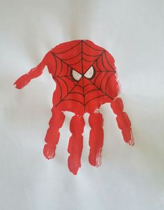 a hand made to look like a spider - man with eyes and hands painted red