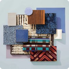 an assortment of different colored rugs on a white wall with blue and brown accents