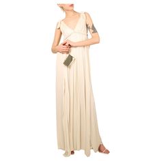 Lanvin Paris Collection Blanche Resort 2011 A beautiful floor length grecian style loose fitting ivory gown with crystal embellished waist band that would work beautifully as wedding or evening dress Double layered dress that falls in ripples of washed silk Frayed edges Exposed back zip Composition: 100% Polyester Size: FR 34 - Due to the oversized fit of this dress it will also work for various other sizes (Please refer to the measurements) Condition: Worn as you can see from the picture, the d Lanvin Wedding Dress, Grecian Style Wedding Dress, White Grecian Gown, Ivory Beaded Lace Gown 1920, Lanvin White Dress, Flapper Style V-neck Evening Dress, Grecian Dress, Embellished Wedding Dress, Ivory Gown