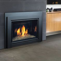 a modern fireplace with fire burning in it