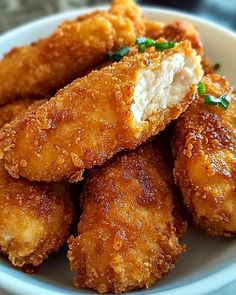 some fried food in a white bowl on a table