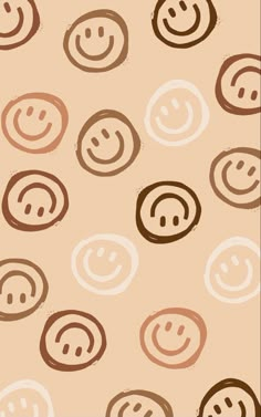 an image of a pattern with smiley faces on the wall in brown and beige colors