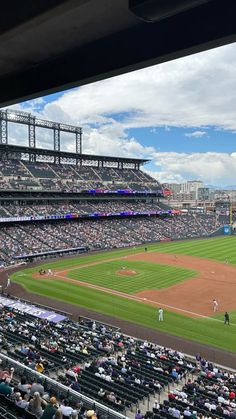 a baseball stadium filled with lots of people