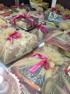 several bags filled with different types of cakes on top of a table next to each other