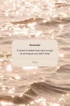 an image of the ocean with sunlight reflecting off it's water and text reading reminder it doesn't matter how slow you go so as long as you don't stop