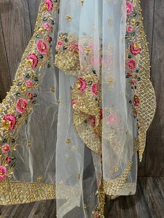 Gorgeous net dupatta with floral embroidered border and sequins work. Light Sky Blue Spring Sharara With Sheer Dupatta, Traditional Spring Sharara With Dori Work, Spring Chanderi Dupatta With Dori Work, Traditional Drape With Dupatta For Spring, Spring Traditional Wear With Dupatta In Traditional Drape, Traditional Wear With Dupatta For Spring, Bollywood Choli With Multicolor Embroidery And Sheer Dupatta, Spring Traditional Saree With Sheer Dupatta, Spring Sheer Dupatta Saree