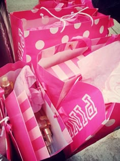 several pink bags with white polka dots on them