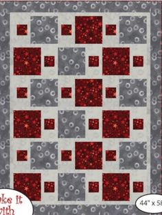 a red and gray quilt with circles on it, the pattern has been made to look like