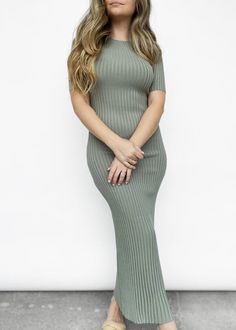 Subtle yet bold - this short sleeve fitted knit midi dress is a staple for the spring season. Featuring a high boat neck, stretch ribbed knit, and 1/4 sleeves. Can be dressed up or down with either sneakers and a denim jacket, or heels and a leather jacket! Model is 5'3" and wears the size 4. Materials: 65% viscose, 35% nylon. Designed in Australia. *SALE ITEMS ARE FINAL SALE & CANNOT BE RETURNED* Return Policy Knee-length Ribbed Knit Midi Dress, Casual Ribbed Midi Length Sweater Dress, Casual Ribbed Midi Sweater Dress, Trendy Stretch Sweater Dress Midi Length, Ribbed Stretch Midi Dress With Short Sleeves, Stretch Ribbed Midi Dress With Short Sleeves, Ribbed Stretch Midi Dress, Stretch Knee-length Ribbed Midi Dress, Trendy Fitted Ribbed Sweater Dress