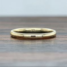 This stunning classic ring is the perfect band for everyday wear. This simple and classic ring is a great way to add to your daily stack. Alternate widths available upon request. Brush finish available upon request Interior engraving is complimentary! Would look great stacked with our 14K Custom Engraveable Nameplate stackable ring - https://etsy.me/3ceYkxK DETAILS: * Handmade to order * Gold KT: 14K * Width of Band: 2mm * Custom gold color: yellow gold, white gold, or white gold * Available in Dainty Band, Engraving Fonts, Inexpensive Wedding, Everyday Ring, Solid Gold Band, Stackable Bands, Everyday Rings, Stackable Ring, Classic Ring