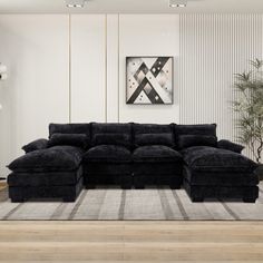 a large black sectional sofa in a living room