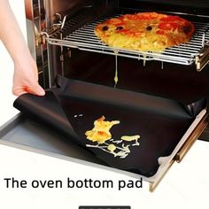 the oven bottom is covered with melted cheese and pizza toppings as someone pulls it out