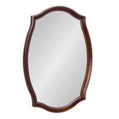 a mirror that is sitting on top of a table with a wooden frame around it