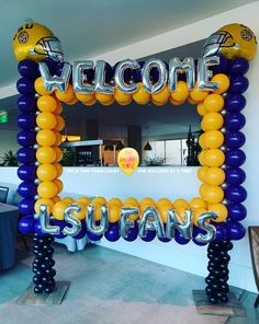 a welcome sign made out of balloons in the shape of lions