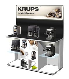 a display case for krupps coffee machines with different types of cups on it