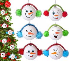 snowman ornaments hanging from a christmas tree