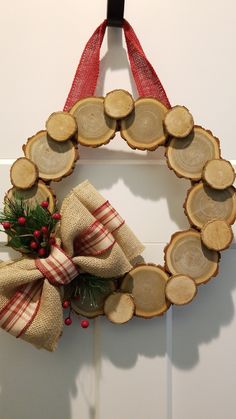 a wreath made out of tree slices and burlocks