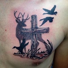 a man with a cross and deer tattoo on his chest