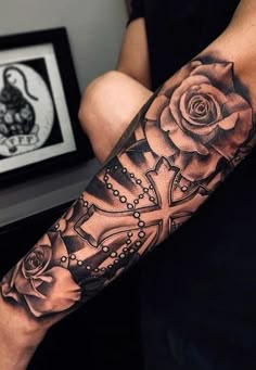 a man with a rose tattoo on his arm