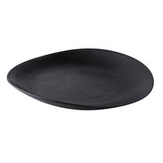 an empty black plate on a white background