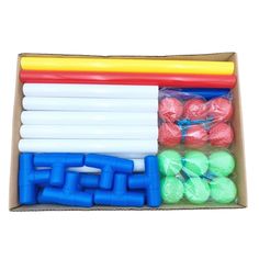 a box filled with lots of different colored plastic balls and tubes on top of each other