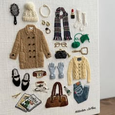 a handmade card with various items on it, including a purse and sweaters