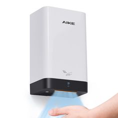 a hand is touching the wall mounted air freshener dispenser