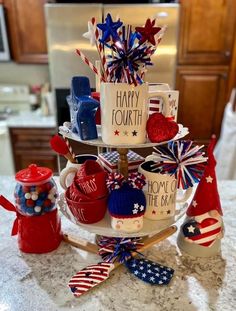 a three tiered cake decorated with patriotic decorations