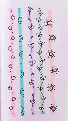 an open book with different colored lines and flowers on the pages, all lined up