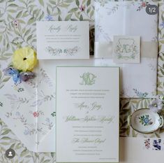 the wedding stationery is laid out neatly