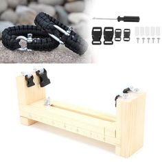 a pair of black and white bracelets sitting on top of a wooden bench next to tools