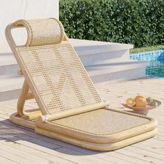 a lounge chair sitting on top of a wooden deck next to a swimming pool with lemons