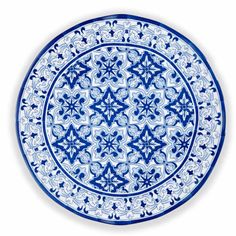 a blue and white plate sitting on top of a table