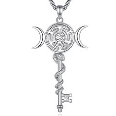 the key to life necklace with crescents and stars on it