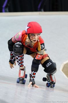 a woman on roller skates in an indoor rink