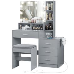 a gray vanity with drawers and lights on it