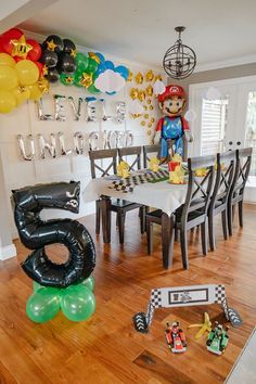 a birthday party with balloons and decorations