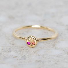 This mini pebble ring has been set with three different coloured sapphires in tones of pink, orange and yellow. Band width 1.2 mm Pebble measures 5.6mm round. Weight 1.3g (approximately) Pictured here with a high shine finish. For a matte finish please leave a note at checkout. Pebble Ring, J Us, Orange And Yellow, My Size, Instagram Icons, Pink Orange, Sapphire, Ring Size, Yellow Gold