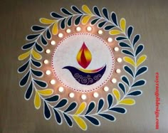 a lighted diya with candles in the center