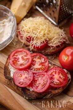 tomatoes, cheese and bread on a cutting board