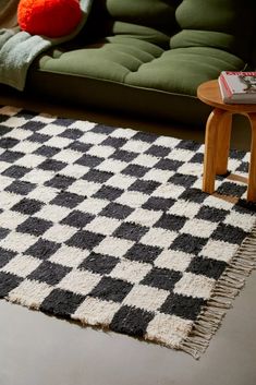 a black and white checkered rug on the floor