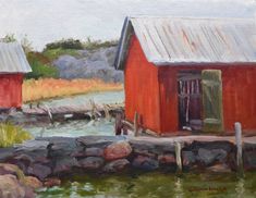 an oil painting of two red barns by the water with rocks and grass around them