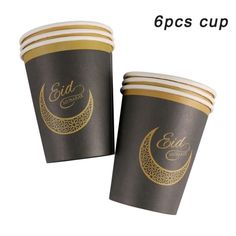 two cups with gold and black designs on the side, one is for eid