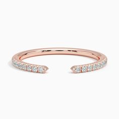 a rose gold ring with white diamonds