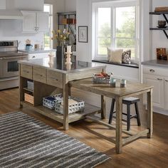 a kitchen with an island and two stools