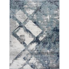 a blue and white rug with an abstract design