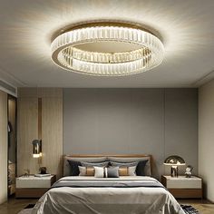 a bed room with a neatly made bed and a chandelier hanging from the ceiling