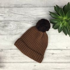 Our tonal brown knitted hat is made from 100% merino wool which is known for being super soft, warm and long lasting.  We choose wool as it is so durable and a natural product. At the end of its life, it is biodegradable.  We believe in beautiful, practical and long lasting items which are unique, a joy to own and will be treasured for many years to come.  - Chocolate and Hazelnut brown  - Designed to fit snug to your head - 100% wool  - Available with or without a pom pom  - Pom pom (if requested) will be in hazelnut brown  - Gift wrapped  || Sizes || Tiny baby - From birth, this is suitable for smaller and premature newborn babies.  0-3 months - From birth to 3 months old  3-6 months - From approximately 3 months old to 6 months and beyond 6 months - 12 months - This hat will adapt to yo Knit Structure, Hat Wool, Hand Knit Hat, Wool Beanie, Knit Beanie Hat, Baby Head, Knitted Hat, Beanie Hat, Vintage Gifts